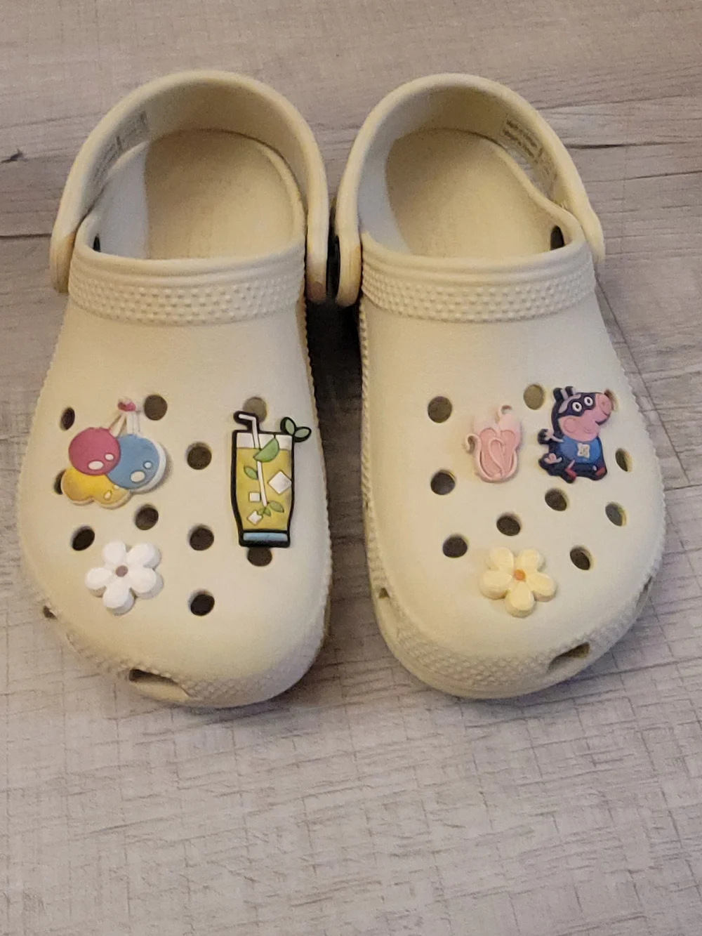 CROCS Kids Cream Slip-On Clogs with Fun Charms
